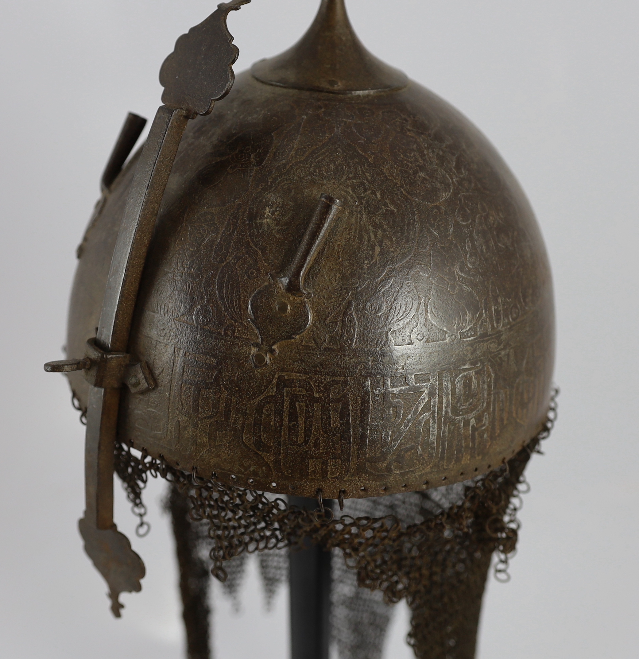 A 19th century Persian Kulah Khud, overall 60cm high, on ebonised stand including a section of human skull